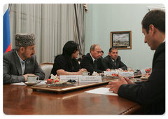 Prime Minister Vladimir Putin with leaders of Dagestan and local militia veterans ten years after international terrorists attacked the North Caucasus republic
