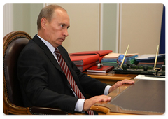 Prime Minister Vladimir Putin at a meeting with Alfa-Bank President Pyotr Aven