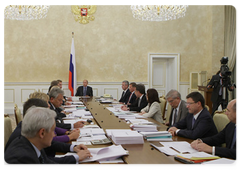 Prime Minister Vladimir Putin conducting a meeting on the draft federal budget for 2010, and the planning period of 2011 and 2012