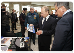 Prime Minister Vladimir Putin at an exhibition of modern rescue equipment inspecting the Emergencies Ministry’s newest rescue and safety technologies