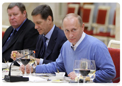 Prime Minister Vladimir Putin dining with members of the IOC's Coordination Commission for the Sochi 2014 Olympic Winter Games