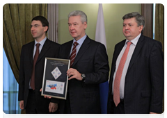 Igor Shchegolev, Segei Sobyanin and Alexander Surinov at the cancellation ceremony for the postage stamp dedicated to the 2010 National Census