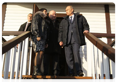 Prime Minister Vladimir Putin visiting one of the new houses in  the village of Verkhnyaya Vereya