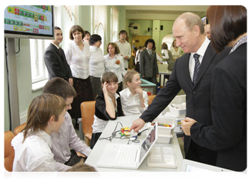 Prime Minister Vladimir Putin visiting Moscow school No. 1060 and examining educational innovations