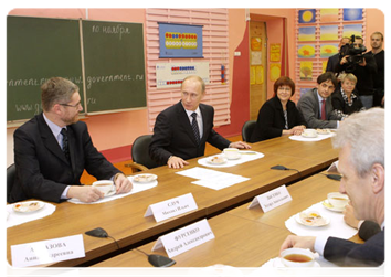 Prime Minister Vladimir Putin meeting with the teachers and parents in the Secondary School 1066