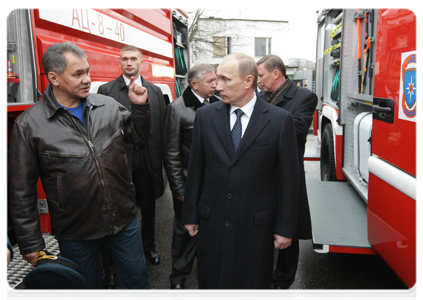 Prime Minister Vladimir Putin visiting the Civil Defence Academy at the Emergencies Ministry where he examined firefighting equipment