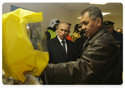 Prime Minister Vladimir Putin visiting the Civil Defence Academy at the Emergencies Ministry where he examined firefighting equipment