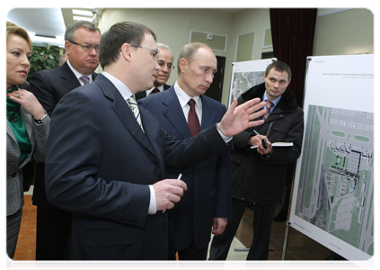Prime Minister Vladimir Putin looking over exhibition stands showing the plans for the development of Pulkovo Airport