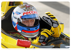 Prime Minister Vladimir Putin at the wheel of a Formula One race car