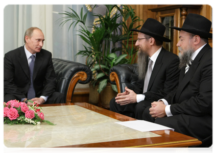 Prime Minister Vladimir Putin at a meeting with Russia's Chief Rabbi Berl Lazar