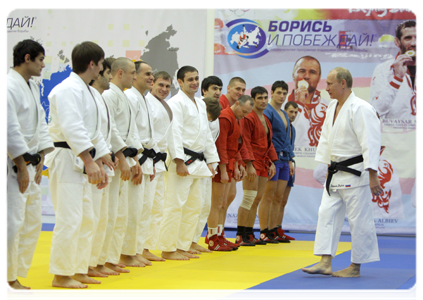 Prime Minister Vladimir Putin taking part in a practice for Russian wrestlers and martial artists during a visit to the Moskovsky sports and fitness centre in St Petersburg