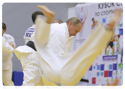 Prime Minister Vladimir Putin taking part in a practice for Russian wrestlers and martial artists during a visit to the Moskovsky sports and fitness centre in St Petersburg