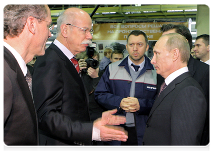 Prime Minister Vladimir Putin talking with Daimler AG Chairman of the Board Dieter Zetsche during his visit to the GAZ Group