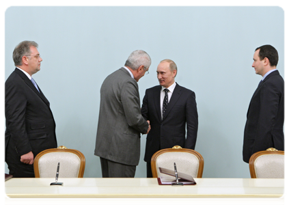 General Electric, Russian Technologies and Inter RAO UES signing a framework agreement to set up joint ventures to manufacture high-tech energy and medical equipment in Russia, Prime Minister Vladimir Putin attending