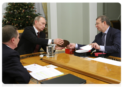 Prime Minister Putin during a working meeting with Deputy Prime Minister Sergei Ivanov and AFK Sistema Chairman of the Board Vladimir Yevtushenkov
