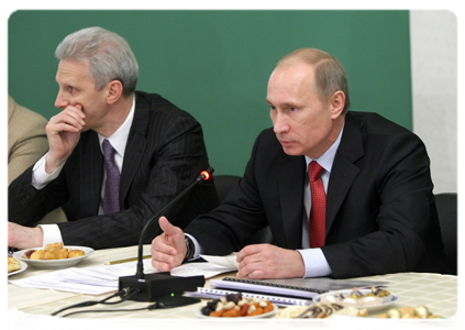 Prime Minister Vladimir Putin and Minister of Education and Science Andrei Fursenko at a meeting with the faculty of the Higher School of Economics