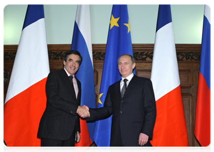 Prime Minister Vladimir Putin holding a limited attendance meeting with his French counterpart Francois Fillon