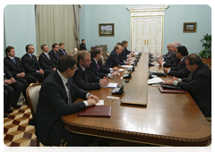 Prime Minister Vladimir Putin with Rafael Dario Ramirez Carreno, Venezuelan Energy and Petroleum Minister