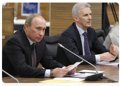 Prime Minister Vladimir Putin and  Minister of Education and Science Andrei Fursenko at a meeting of the Presidium of the Presidential Council for Priority National Projects and Demographic Policy