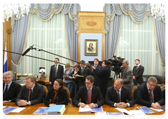Prime Minister Vladimir Putin chairing a meeting to discuss efforts to develop housing construction and provide people with housing