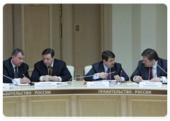 Government members at a meeting on preparations for the 2010 spring sowing season
