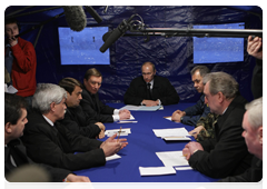 Russian Prime Minister Vladimir Putin holding a meeting of the emergency response team at the site of the April 10, 2010 Tu-154 crash