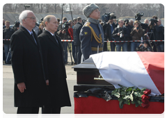 Vladimir Putin and Polish Ambassador to Russia Jerzy Bar at the memorial service for Lech Kaczynski, who died in a plane crash near Smolensk
