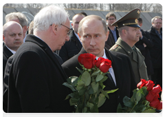 Vladimir Putin and Polish Ambassador to Russia Jerzy Bar at the memorial service for Lech Kaczynski, who died in a plane crash near Smolensk