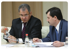 Russian Minister of Civil Defence, Emergency Situations and Disaster Relief, Sergei Shoigu, and Federal Air Navigation Service chief Alexander Neradko attending a meeting of the state commission to investigate the causes of the Tu-154 plane crash