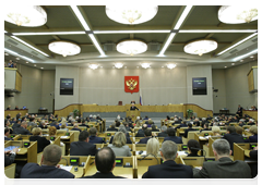 Prime Minister Vladimir Putin delivers an annual report to the State Duma on government performance in 2009