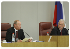 Prime Minister Vladimir Putin delivers an annual report to the State Duma on government performance in 2009