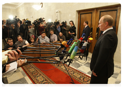 Prime Minister Vladimir Putin answering questions from the media