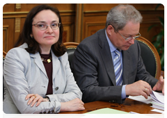 Minister of Economic Development Elvira Nabiullina and Minister of Regional Development of the Russian Federation Viktor Basargin at a meeting to discuss stable financial support for road construction, reconstruction, overhaul, repair and maintenance
