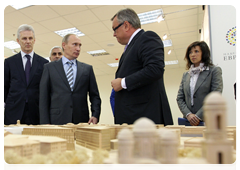 Prime Minister Vladimir Putin examines the new building for the Russian research centre Applied Chemistry in St Petersburg