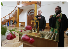 Prime Minister Vladimir Putin visiting the nearby church of Theotokos: Salvation of the Perished