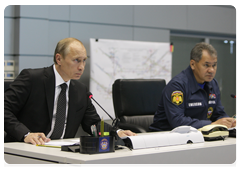 Prime Minister Vladimir Putin and Minister of Civil Defence, Emergencies, and Disaster Relief Sergei Shoigu at a videoconference in the Situations Room of the Ministry of Civil Defence, Emergencies and Disaster Relief to discuss the recent accident at the Raspadskaya coal mine in the Kemerovo Region