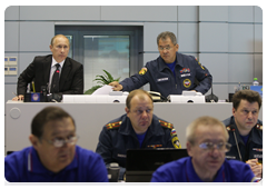 Prime Minister Vladimir Putin and Minister of Civil Defence, Emergencies, and Disaster Relief Sergei Shoigu at a videoconference in the Situations Room of the Ministry of Civil Defence, Emergencies and Disaster Relief to discuss the recent accident at the Raspadskaya coal mine in the Kemerovo Region