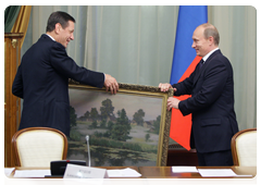 Prime Minister Vladimir Putin congratulating Deputy Prime Minister Alexander Zhukov on his birthday