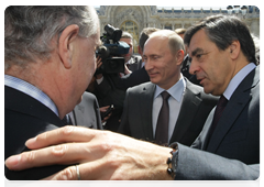 Prime Minister Vladimir Putin and Prime Minister Francois Fillon of France examining plans for a monument to the Russian Expeditionary Force that fought in France during World War I