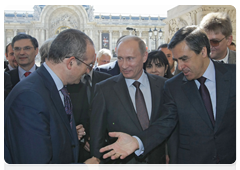 Prime Minister Vladimir Putin and Prime Minister Francois Fillon of France examining plans for a monument to the Russian Expeditionary Force that fought in France during World War I