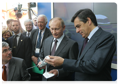 Prime Minister Vladimir Putin and French Prime Minister Francois Fillon visiting the Russian National Exhibition at the Grand Palais in Paris
