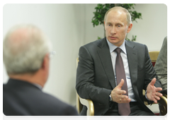 Prime Minister Vladimir Putin at a meeting with Christophe de Margerie, CEO of the Total Group, in Paris