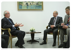 Prime Minister Vladimir Putin at a meeting with Christophe de Margerie, CEO of the Total Group, in Paris