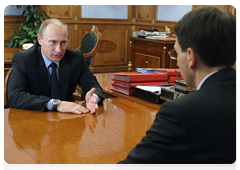 Prime Minister Vladimir Putin at a working meeting with Minister of Communications and Mass Media Igor Shchegolev