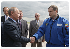 Prime Minister Vladimir Putin at a test flight of a fifth-generation Russian fighter jet, after which he spoke with the test pilot