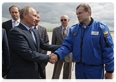 Prime Minister Vladimir Putin at a test flight of a fifth-generation Russian fighter jet, after which he spoke with the test pilot