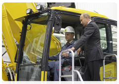 Prime Minister Vladimir Putin during his trip to the Yaroslavl Region touring a new production facility owned by leading Japanese construction equipment manufacturer Komatsu