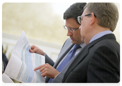 Deputy Prime Minister and Finance Minister Alexei Kudrin and Deputy Finance Minister Alexander Novak before a meeting on federal budget spending on industry and transport for 2011-2013