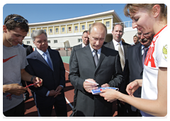 At the athletes’ request, Vladimir Putin autographed several Meteor pennants
