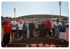 Prime Minister Vladimir Putin with athletes at Meteor stadium in Zhukovsky